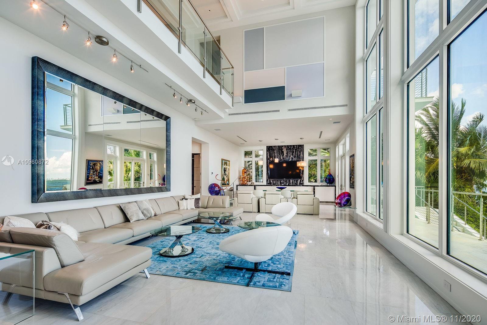 No expense was spared on this beautiful custom-built modern home, designed by famed architect Jorge Hernandez for a prime location with 100 feet of frontage directly on Biscayne Bay. With stunning views of downtown Miami and Key Biscayne, the wonderful open design concept allows for both ease of living and great spaces for entertaining, taking full advantage of the magnificent location. The home also comes with a theatre, summer kitchen, saltwater pool, and private dock and boatlift.