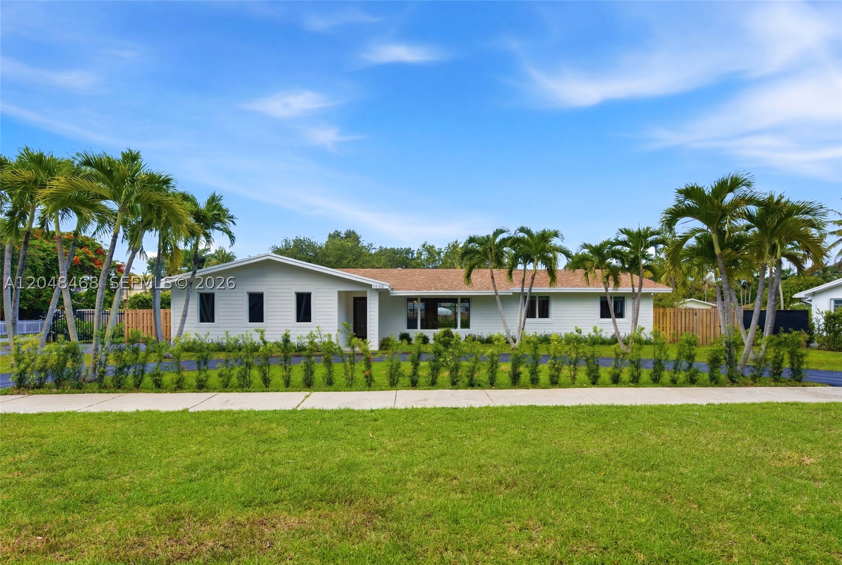 Experience modern luxury and timeless elegance in this stunning 5-bedroom, 3-bath corner-lot residence on a spacious corner lot in Palmetto Bay. This beautiful home features a bright open layout with sleek custom finishes and abundant natural light streaming through impact glass. The gourmet kitchen offers premium appliances, a large island, and bespoke cabinetry flowing seamlessly into the living and dining areas. The primary suite provides a serene retreat with large bath and custom closets. Step outside to your tropical oasis with a sparkling pool, lush landscaping—perfect for relaxing or entertaining. Ideally located near top-rated private schools, parks, and the Deering Estate.