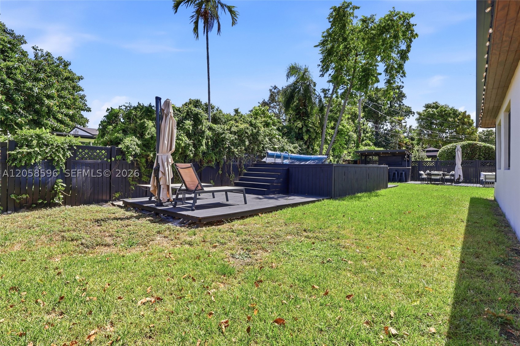 No HOA. Gables View corner lot, 8,600 SF, minutes to Coral Gables and Schenley Park.  Three-bedroom taken down to the studs  and rebuilt, delivered turnkey.

Impact windows and doors throughout. Tile roof 2023. AC unit and full ductwork replaced. Tankless water heater. Engineered hardwood in living areas and bedrooms, porcelain tile in both fully remodeled baths. Upgraded kitchen with stainless appliances.

Backyard is built to entertain: above-ground pool and outdoor
kitchen, both freestanding and fully removable. Keep the
current setup or clear it and redesign. 8,600 SF gives you
room for an in-ground build.

Available fully furnished, conveyed by separate bill of sale.