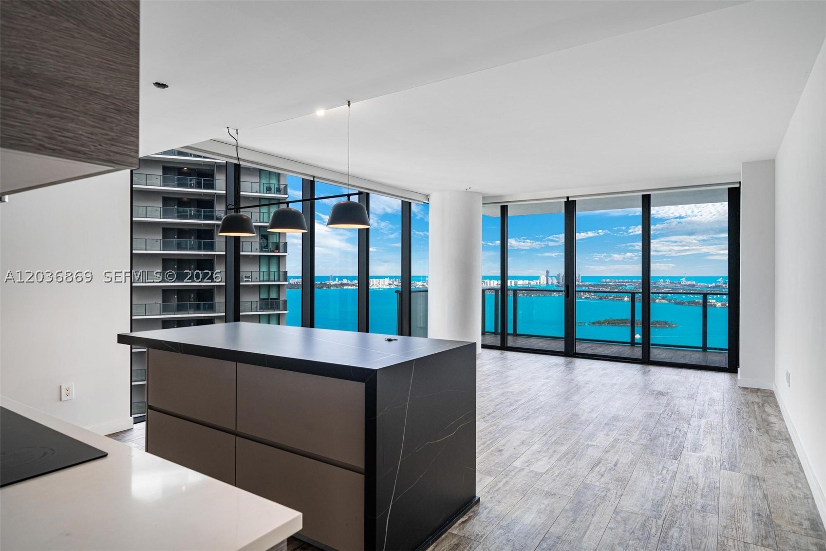 Rarely available for rent, this sophisticated 1 Bed + Den, 2 Bath residence at Paraiso Bay offers refined waterfront living with breathtaking bay and skyline views and upgraded finishes
Designed with elevated custom finishes throughout, the unit features a bespoke kitchen island with a stone waterfall countertop, a beautifully appointed den, and three custom closets in the primary suite. The primary bathroom has been upgraded into a spa-like retreat with a high-end triple-control shower system, while distinctive design details  including a custom black mirror wall and electric blackout shades — create a sleek, modern atmosphere.
Enjoy the privacy and exclusivity of direct elevator entry, along with a generous 215 sq. ft. terrace ideal for relaxing or entertaining while overlooking Miami’s iconic waterfront.
Paraiso Bay offers some of Edgewater’s most complete resort-style amenities, including a lagoon-style pool, state-of-the-art fitness center, spa, tennis courts, theater, bowling alley, children’s playroom, and elegant social spaces.
Perfectly located minutes from Wynwood, the Design District, Midtown, Miami Beach, Brickell, and Miami International Airport, this residence delivers the ideal combination of luxury, privacy, design, and convenience in one of Miami’s most desirable waterfront communities. Currently rented 5300/month with possibility of extending lease or 1 month notice