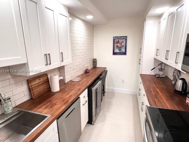 One of a kind beautiful and renovated condo unit in a quiet +55 building. A 24 hour lobby security. Building has recently renovated lobby and elevator. Passed the 40 years inspection. The building has a 4 year old roof, new painting and parking area has been resurfaced, This unit has a gorgeous balcony facing Hard Rock Guitar. Unit comes with a bicycle storage and a personal storage. Close to beaches and major highways, dining and hospitals. A must see with impact windows. Ceiling has been cleared of popcorn and painted. Also walking pathway with lovely nature surrounding.