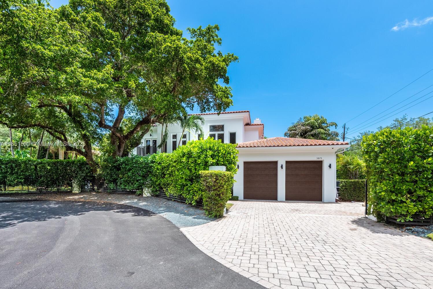 Stunning Modern Mediterranean Home in Coconut Grove
Set on a lush 14,000 SF lot at the end of a quiet cul-de-sac, this 2-story home blends luxury and comfort. Featuring 5 bedrooms and 5 bathrooms, each with a walk-in closet and ensuite. The chef-inspired kitchen boasts a large center island, perfect for entertaining, and the open-concept family room leads to the pool area, ideal for gatherings. Additional highlights include designer porcelain floors and wood floors, impact windows, a separate laundry room, and a 2-car garage. Close to parks, shopping, and dining, this home offers the best of Coconut Grove living