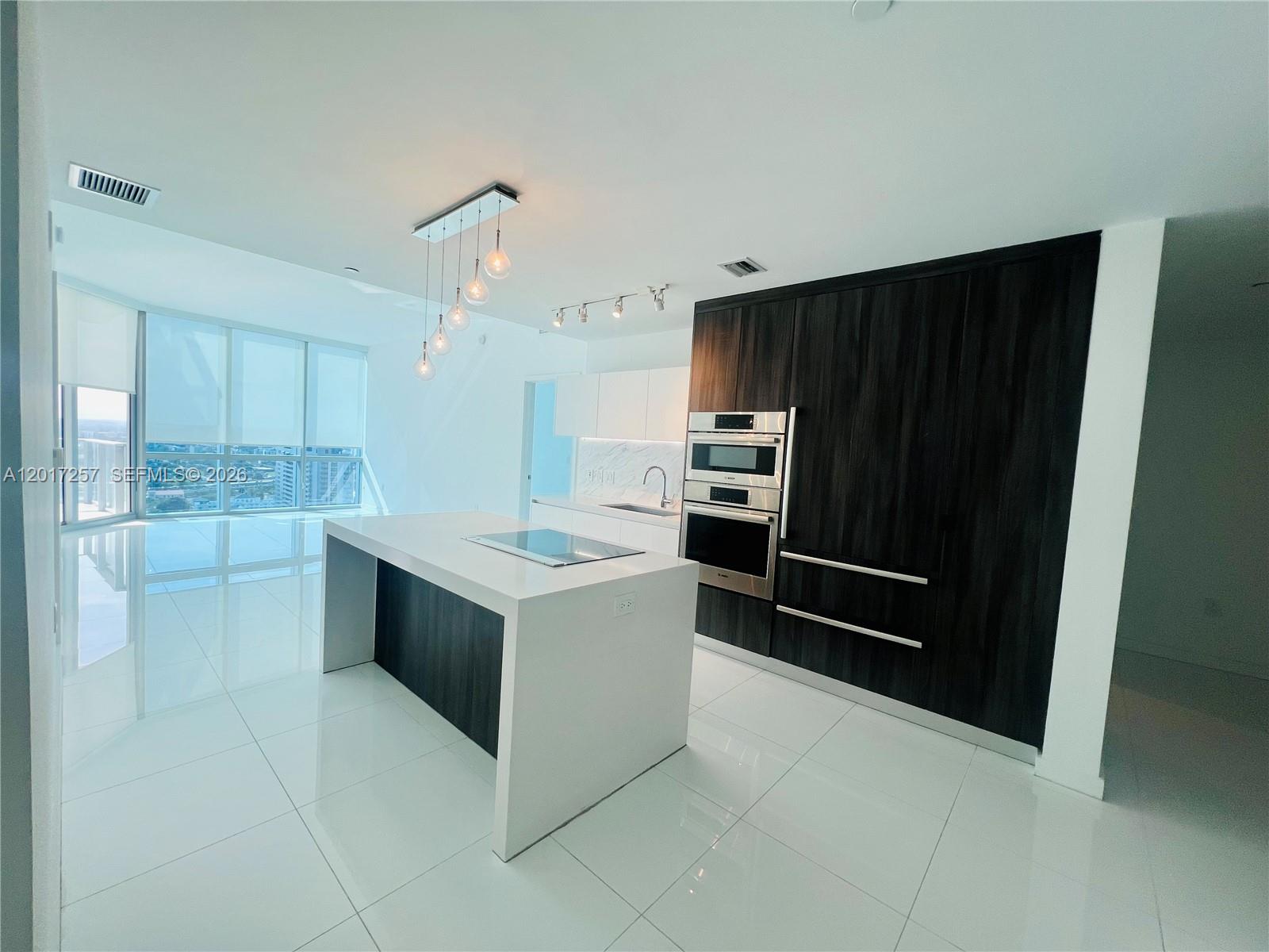 GORGEOUS 2BD+HUGE DEN W/CLOSET THAT CAN BE A 3rd BED, 3 BATHS CONDO AT LUXURY PARAMOUNT MIAMI WORLD CENTER. OVER SIZED BALCONY OVERLOOKING MIAMI SKYLINE, PRIVATE ELEVATOR. WALKING DISTANCE TO VIRGIN TRAIN STATION, METRO MOVER, BAYSIDE, PORT OF PRIME PRIME LOCATION IN THE HEART OF MIAMI STEPS TO KASEYA CENTER, ART MUSEUM. SHORT DRIVE TO MIAMI INT'L AIRPORT, BRICKELL, WYNWOOD AND MIAMI BEACH. HOA INCLUDES INTERNET AND CABLE, WATER, AND TRASH REMOVAL. ONE ASSIGNED PARKING SPACE AND ONE COMPLIMENTARY VALET. PLENTY OF LUXURY AMENITIES AND SERVICES. FIVE POOLS, BASKETBALL COURT, BOXING COURT, RACQUETBALL, YOGA, SAUNA, SPA, ULTIMATE GYM, BBQ KITCHEN, VIRTUAL GOLF, RECORDING STUDIO, KIDS PLAY AREA. SOCCER FIELD, TENNIS COURT, SKY DECK, OBSERVATORY. JACUZZI ON 53rd FLOOR OVERLOOKING MIAMI SKYLINE. 24 HRS CONCIERGE, VALET PARKING, SECURITY.