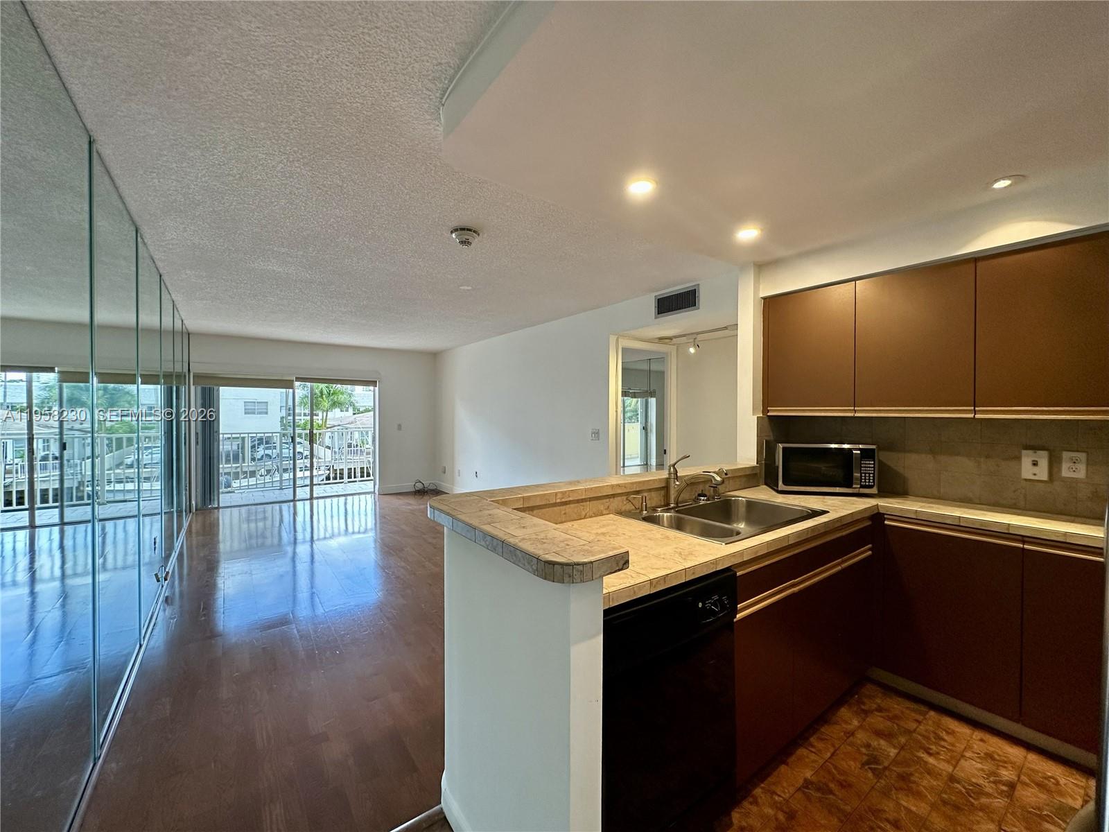 Freshly painted 1-bedroom, 1.5-bath residence in a boutique waterfront building located within a gated community in Eastern Shores, just steps from the beaches of Sunny Isles. This bright unit features a private balcony with canal views, stainless steel appliances, and a comfortable layout ideal for relaxed coastal living. Quiet residential setting with no special assessments. Building offers elevator, laundry room, assigned parking plus guest parking. Prime location within walking distance to beach, supermarkets, restaurants, and daily conveniences, with easy access to Biscayne Blvd, 163rd Street, and major expressways. Excellent opportunity in a highly desirable waterfront neighborhood.