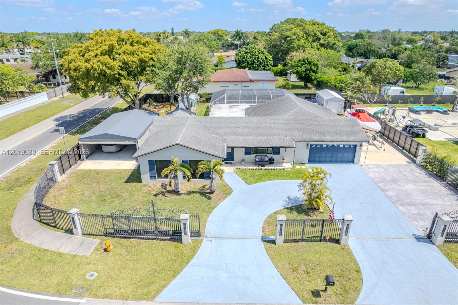 If you've been looking for a home that has it all, look no further! Absolutely stunning 4BR/2BA pool home with a studio apartment on a 15,889 sf corner lot that has room on both sides for boats, RV's or any other toy. Hurricane impact windows/doors, new A/C, and 11 year old roof. Oversized lot with a stamped concrete circular driveway, motorized gates and a 30x20 concrete slab with canopy. Inside you'll find a beautiful and meticulously kept open concept layout with tile flooring and recessed lighting throughout. Incredible kitchen with wood Victorian style cabinets, granite counters, stainless steel appliances, pot filler faucet, and wine cooler. Utility room with new washer/dryer. Gorgeous family room with vaulted ceiling and matching cabinets. Fabulous master suite with ample walk-in closet. Master bathroom with His & Her sinks, wood vanity, glass encased shower and Jacuzzi soaking tub. Bright and spacious bedrooms with a renovated guest bathroom. 2 Car garage was previously converted to a studio apartment with kitchenette and full bathroom for in-laws, older kids or to generate extra income. Step outside and enjoy the spectacular covered patio with outdoor kitchen overlooking the pool and Jacuzzi while in the comfort of the screened-in enclosure. Two separate sheds provide plenty of storage and the chicken coup is a must for anyone who enjoys homegrown eggs. Cat 5 wiring throughout the house. Excellent location near supermarkets, shops, restaurants, US1 and the Turnpike.