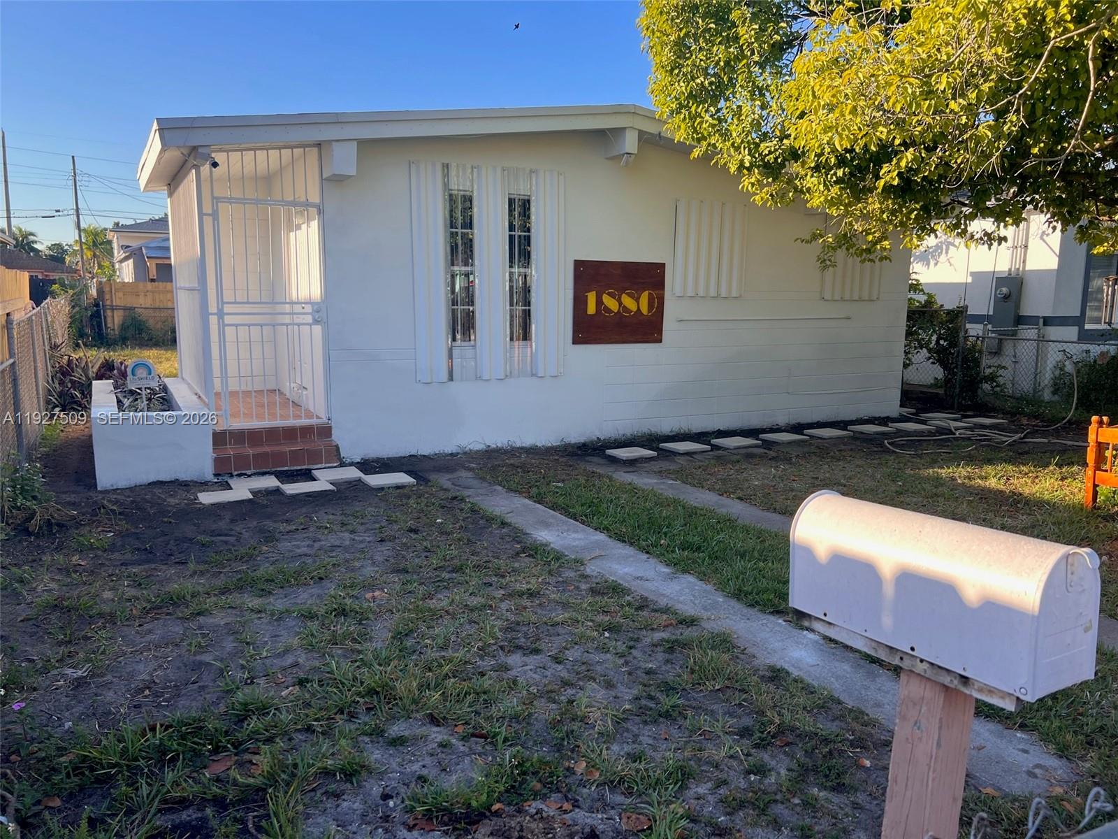 Ceramic tile floors, Central AC, a fully fenced lot with a gate, side-by-side stainless fridge, butcherblock countertops, washer and dryer, and new roofing. Cool, northern exposure with mature trees providing shade. Good, practical layout.