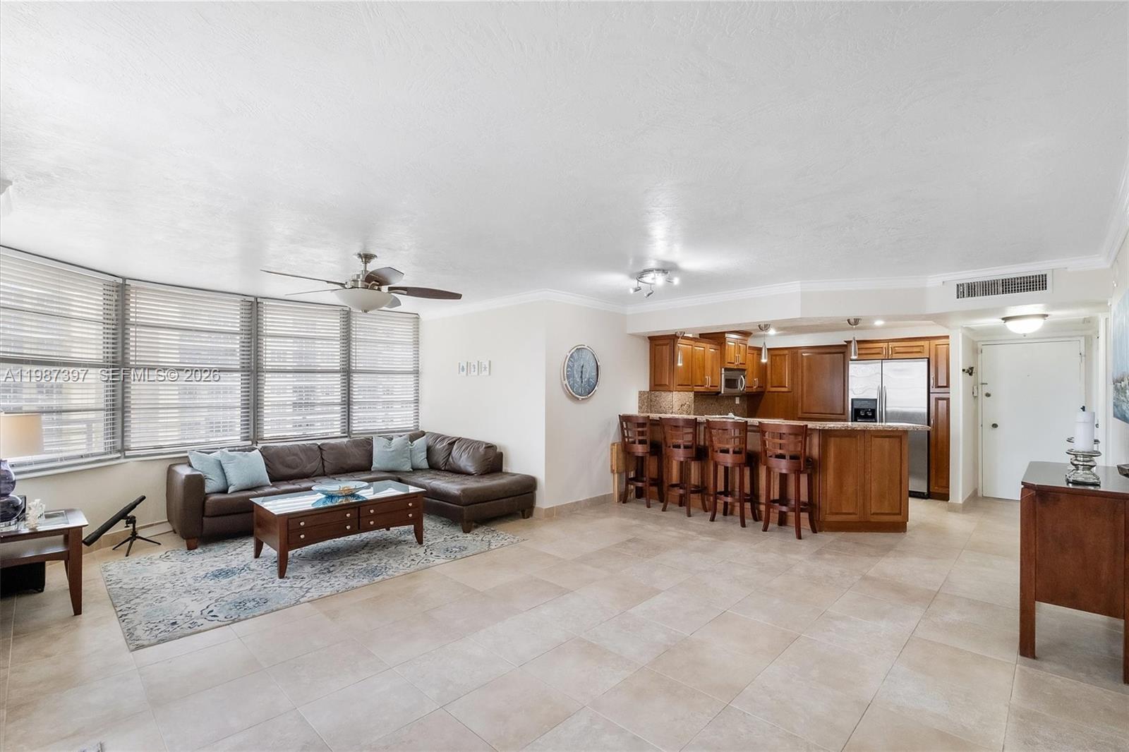 Beautiful 1-bedroom, 1-bathroom corner unit with abundant natural light and city views. Features an updated kitchen, spacious bedroom, and expansive wraparound balcony ideal for enjoying coastal breezes and sunsets. Residents enjoy direct beach access with lounge chairs and umbrellas, one assigned parking space, valet service, and full-service concierge. The building is currently undergoing renovations; renderings of planned enhancements are included in the listing photos. Beach access and services are currently available. Ideally located along the iconic beachfront boardwalk, extending south to South Pointe Park and north to Bal Harbour, with convenient access to Downtown Miami.  SPECIAL ASSESSMENTS HAVE BEEN PAID IN FULL.