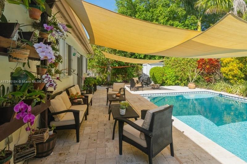 A tropical retreat is found in this lushly landscaped pool home. Spacious 3 bedrooms with a 4th bedroom/office/bonus room. Formal living room, family room/dining area. Updated baths. Impact windows & doors. The saltwater pool is heated and has LED lights. Gas hot water heater/stove/dryer. Newer fiberglass roof. A/C is 4 tons. The kitchen has an updated refrigerator and a large titled countertop. Family community of Palmetto Bay with top-rated schools. Close to major shopping and highway. A pleasure to show and see.