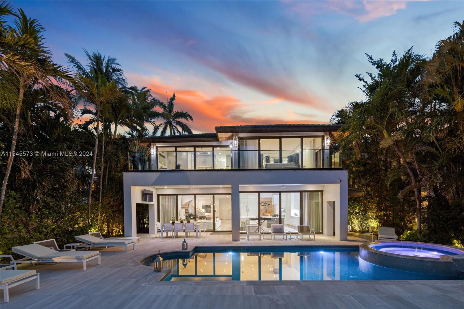 Lush tropical landscaping surrounds this exquisite contemporary waterfront residence, showcasing mesmerizing Miami Beach views through expansive floor-to-ceiling telescopic sliding glass doors. This stunning home offers 7 bedrooms plus a versatile gym/flex room, and 7.5 bathrooms. Features include an elegant Italian kitchen with premium Miele and SubZero appliances, luxurious Dornbracht bath fixtures, and a state-of-the-art Lutron and Savant smart home system. Enter through a picturesque courtyard into an open-concept layout that flows seamlessly to a spacious outdoor area with wide bay views. Enjoy the ultimate Miami lifestyle just moments from Sunset Harbor, the Design District, and downtown’s world-class shopping, dining, and nightlife.