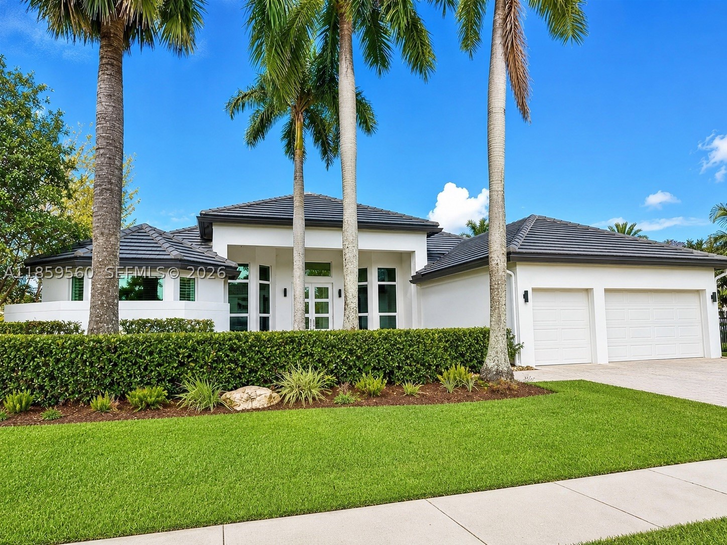 Live the ultimate Weston Hills lifestyle in this impeccably updated home with panoramic views of the Players Course. Set in an exclusive gated community, it offers a NEW roof, full-impact windows/doors, and refined finishes throughout. The owner’s suite is a serene escape with dual walk-in closets and a luxurious renovated bath featuring porcelain accents, freestanding tub, and walk-in shower. A chef’s dream kitchen boasts Miele cooktop, Subzero refrigerator, and double wall ovens. Secondary bedrooms feature new flooring and generous closets. Outside, a newly redesigned travertine patio frames the resurfaced heated  pool and spa,your private resort overlooking the golf course. Truly move-in ready!