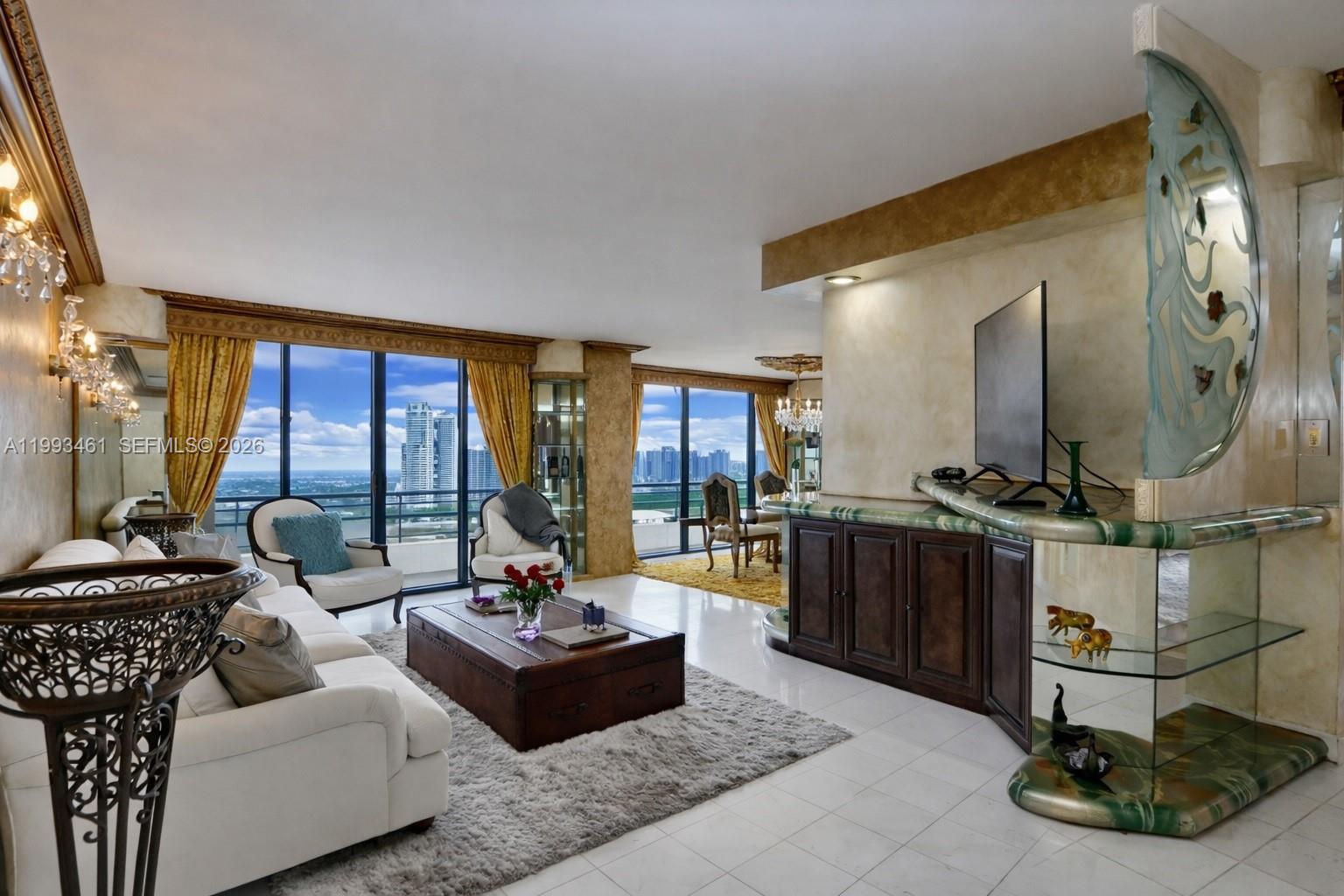 Experience luxury living at Mystic Pointe in Aventura. This beautifully renovated Venetian-style corner residence offers 3 bedrooms, 3 bathrooms, and 1,694 sq ft of elegant living space.
Enjoy breathtaking panoramic views of the ocean, bay, Intracoastal, canal, Golden Beach, and downtown skyline among the most exceptional views in Mystic Pointe.
The residence features a refined Venetian-inspired design with sophisticated color palettes, crown moldings, and custom baseboards. An open kitchen flows seamlessly into the living and dining areas, ideal for both everyday living and entertaining. Additional highlights include, a dedicated laundry room, and hurricane shutters.
Rarely available corner unit with unmatched views. This is a must-see. Schedule your private showing today and don’t miss this exceptional opportunity.Come and see what Mystic Pointe has to offer! Resort style living! Full building amenities including, fitness center, heated pool, Jacuzzi, Sauna, game room, library, 7 clay tennis courts, 2 pickle ball courts, 1 basketball court, child playground, 2 dog parks and e-cars charging stations. Mystic Pointe is a desirable and an all inclusive gated community. Location close to restaurants, beach, Aventura mall and house of worship. Easy to show! Call listing agent.