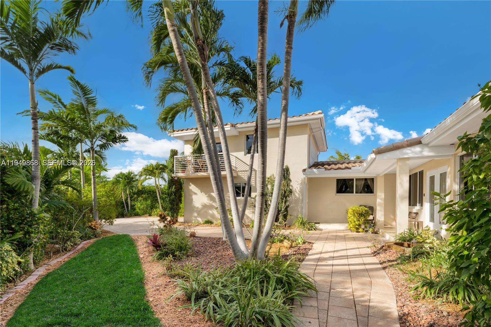 Step Inside With Me! Experience waterfront living on the gated island of Biscayne Point with no fixed bridges and direct ocean access. This home offers comfortable interiors, featuring 3 bedrooms and 3 baths in the main residence plus a private guest house. The guest house offers 1 bedroom and 1 bath, a garage, kitchen, balcony, and separate entrance. Recent upgrades include a roof in 2010, updated pool in 2025, flooring, AC, hurricane impact windows and doors, seawall, and dock. Enjoy outdoor entertaining at the inviting pool setting, expansive terrace, lush landscaping. Ample parking completes this offering. Just minutes from Bal Harbour, fine dining, beaches, and a quick boat ride to Haulover Inlet, this property offers true waterfront living in a thriving neighborhood.