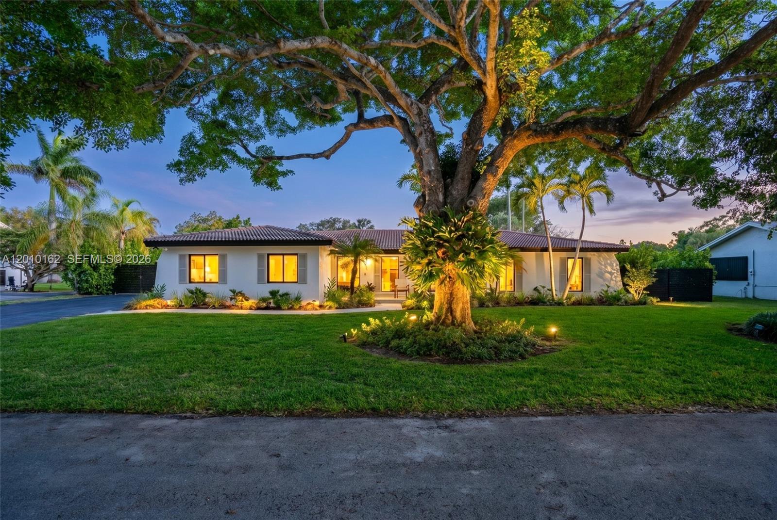 Charming and tastefully renovated home in Palmetto Bay! This beautifully updated 4-bedroom, 2-bath home is magazine worthy! Featuring a bright open-concept layout, the home welcomes you with a spacious living room overlooking the front garden, flowing effortlessly into the dining area and a stunning, fully renovated kitchen complete with marble countertops and custom finishes. The adjacent family room showcases a thoughtfully designed built-in, creating the perfect space for everyday living and entertaining.
All four bedrooms are thoughtfully positioned on one side of the home, including a serene primary suite with a walk-in closet, double vanities, soaking tub, walk-in shower, and peaceful views of the backyard. Both bathrooms have been impeccably renovated with high-end finishes throughout. Step outside to your private backyard oasis, featuring a pool, summer kitchen, expansive yard space, and plenty of room to entertain. Additional highlights include impact windows and doors (excluding garage), a 2-car garage, oversized laundry room, 2018 roof, and plumbing lined with PVC for added peace of mind. A move-in-ready home that perfectly combines modern upgrades with timeless charm in one of Palmetto Bay’s most desirable neighborhoods.
