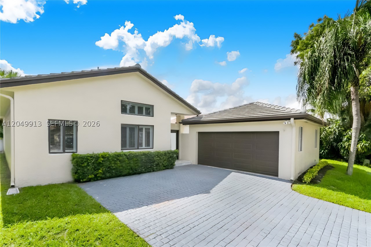 Beautifully remodeled 3/2 home in the heart of Miami Lakes offering the perfect blend of modern style and resort-style living. Enjoy a private backyard oasis with an automated saltwater pool featuring a Wi-Fi-enabled pump, customizable LED lighting, a 24'x15' pool, and an 8'x18' courtyard entry. The outdoor space also includes elegant travertine marble flooring and a custom insulated pergola with electrical outlets, creating the ideal setting for gatherings, outdoor dining, or peaceful evenings. Vaulted ceilings and skylights fill the home with natural light. The remodeled galley kitchen boasts modern white cabinetry, a quartz waterfall countertop, stainless steel appliances, and a pantry. Sliding doors from the living room, kitchen, and primary suite provide seamless indoor-outdoor living. The spacious primary suite features a walk-in closet, sitting area, and a beautifully renovated bath with a double walk-in shower, dual vanity, and cabana bath access. Additional upgrades include impact windows and doors and a detached two-car garage. Ideally located - just a 2-minute walk from Jake Duque Park and close to shopping, dining, and top-rated schools. Move-in ready and designed for comfortable South Florida living!