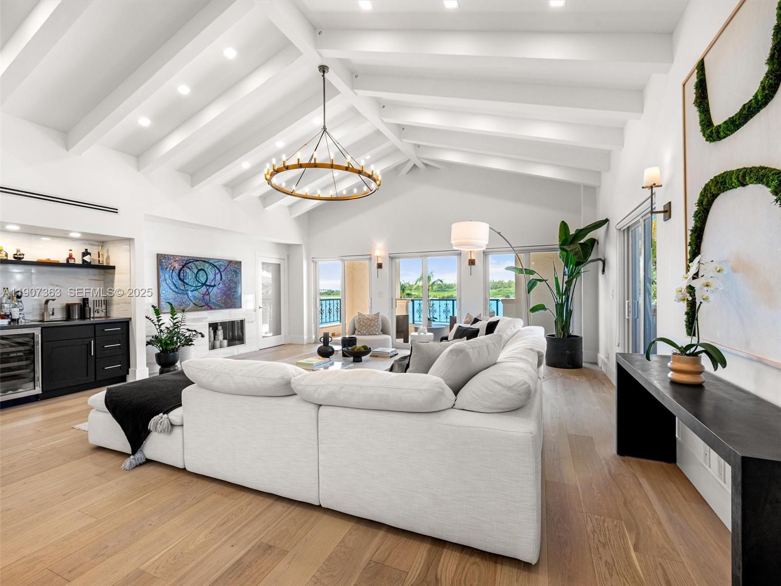 Step into luxury living in this fully renovated Bayside Village Penthouse on Fisher Island. This stunning residence features 3 bedrooms, 3.5 baths, 2,744 sq ft interior, soaring vaulted ceilings that elevate the living spaces, wrap around terraces, French oak wood floors throughout, upscale light fixtures, state-of-the-art kitchen with top of the line appliances, impact glass doors and windows, automated window treatments and an open layout maximizing natural light. Enjoy pristine views of the Miami downtown skyline, Biscayne Bay and Virginia Key from this exceptional Penthouse!