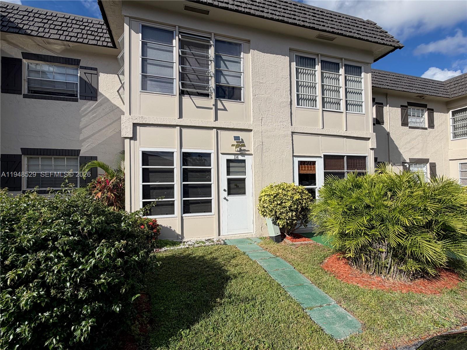Move-in ready 1-bedroom, 1-bath renovated condominium offering 680 square feet of comfortable living space in a well-maintained 55+ community. This desirable first-floor unit features an enclosed patio / Florida room, providing flexible additional living space for relaxation, hobbies, or storage.

The residence has been recently renovated with a new kitchen and new bathroom, and is offered in turnkey condition. The spacious primary bedroom includes a walk-in closet plus two additional oversized built-in closets, offering exceptional storage rarely found in a one-bedroom unit. An open living and dining area creates an easy, functional layout ideal for everyday living.

The unit is fully furnished and equipped, making it well-suited for full-time or seasonal occupancy. One assigned parking space is included, along with abundant guest parking and exterior bicycle storage for added convenience. Water is included in the monthly condominium fee.

Residents enjoy an active lifestyle with access to a heated pool, tennis and pickleball courts, shuffleboard, bocce, BBQ area, clubhouse, fitness room, billiards, library, and a full calendar of social activities, all surrounded by mature landscaping and garden pathways.

Conveniently located near shopping, dining, major highways, and approximately 6 miles from the beach and airport. Rentals permitted with restrictions.