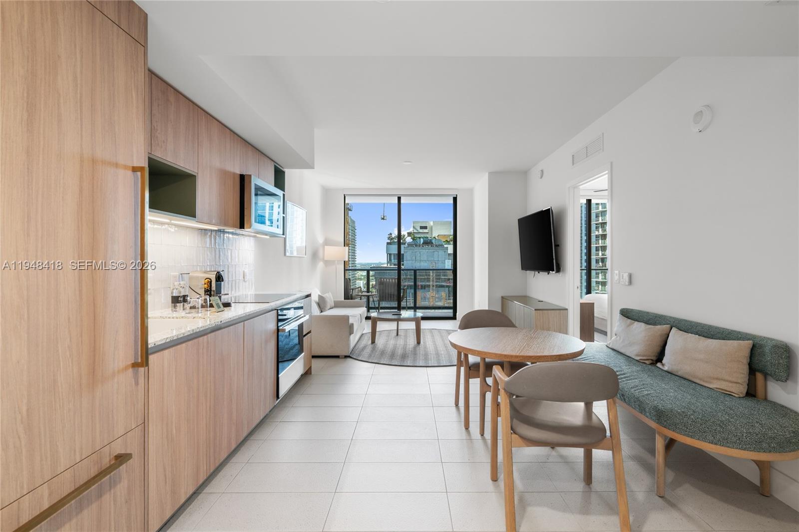 Bright and fully furnished 1-bedroom, 1-bath residence on a high 28th floor at Gale Miami Hotel & Residences, offering open skyline and downtown views. Floor-to-ceiling windows
provide abundant natural light and a spacious, airy feel. The unit features a modern open layout, contemporary finishes, and a private balcony ideal for enjoying city views. Sold
turnkey and fully furnished, allowing owners to use and rent the unit simultaneously. This condo-hotel offers flexibility: owners may participate in hotel management or self-manage
short-term rentals, including Airbnb. Prime Downtown Miami / Miami World Center location, close to Brightline, restaurants, shopping, and entertainment.