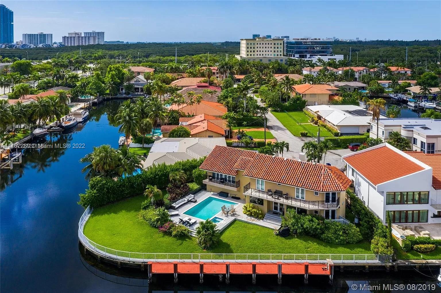 Step inside this one of a kind waterfront home with top notch tropical designer furnishings. Located In a private gated community of Eastern Shores. 5 Suites 5.5 Full bathrooms each having its own walking closet. This magnificent house has A formal dining room, open kitchen with gourmet Viking professional appliances, huge double refrigerator, double oven, gas stove and griddle top. A movie theatre room. Marble and wood floors throughout. 
Oversized lot of approx. 180 ft of Waterfront on deep water-wide canal ***NO FIX BRIDGES***for a yacht and extra boat. The generous outdoor area provided you with the ultimate entertaining space has a heated pool and lush landscape. Enjoy the stunning waterfront views.