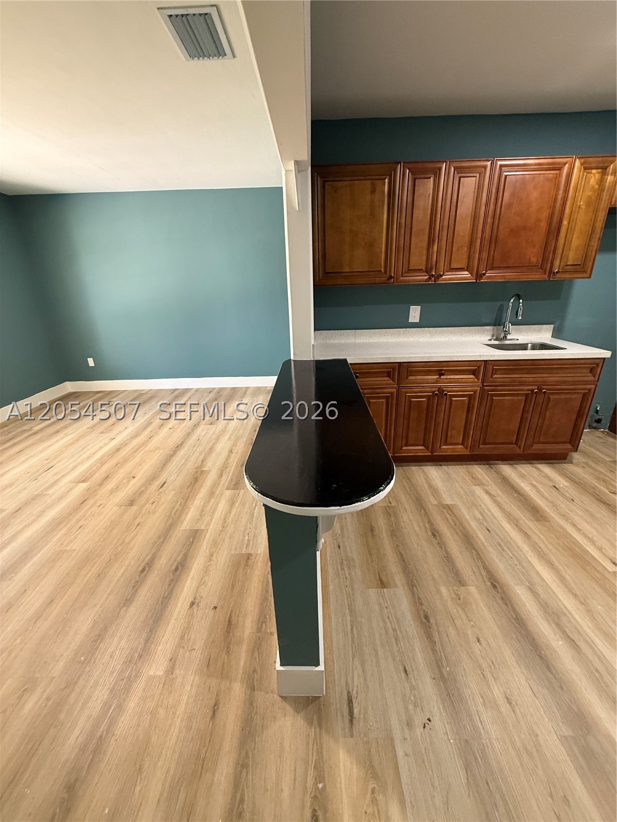 Beautifully remodeled home featuring a new roof, new A/C, new laminate flooring, and a fully renovated bathroom. The oversized backyard offers plenty of space for outdoor entertaining, recreational vehicles, work vehicles, or future improvements, subject to local regulations. Conveniently located near beaches, shopping, dining, and major highways. Move-in ready!