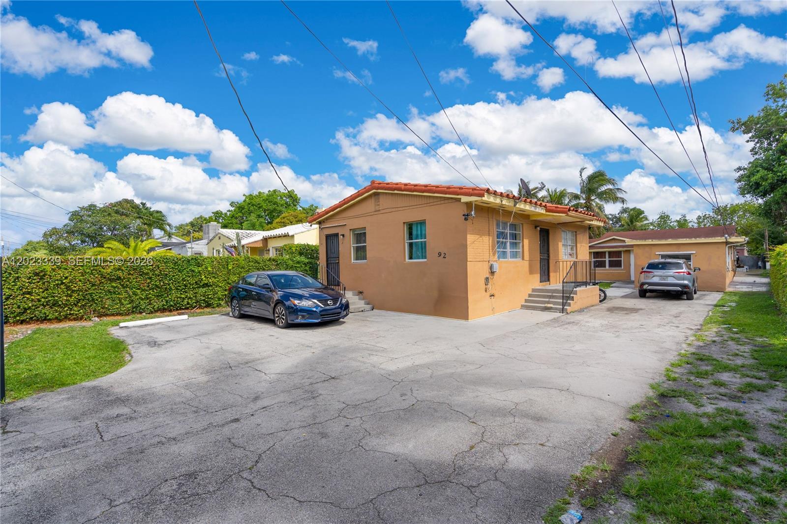 Excellent income-producing opportunity featuring two fully detached units on a spacious lot with separate parking and private layouts. Front unit is a large 2BD/1BA offering a full kitchen, living room, dining area, oversized bedrooms, and dedicated parking. Rear detached structure is configured as a 4BD/2BA and currently operated as a 3BD/1BA plus separate efficiency for additional rental income potential. Rear main unit includes full kitchen, living/dining areas, and separate parking from the efficiency. Large lot comfortably accommodates multiple vehicles. Prime location near the Citadel, Design District, major highways, shopping, dining, and entertainment. Ideal for investors or owner-occupants seeking strong income potential. 3D tour available.