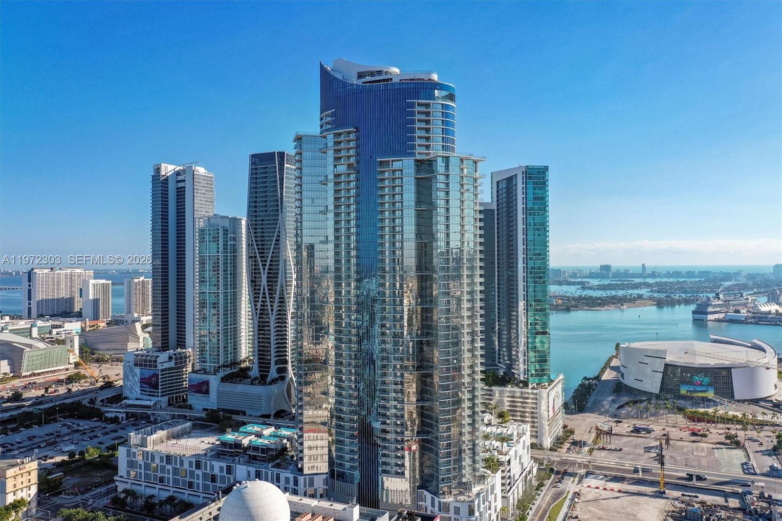 Stunning PH 3-bedroom + den, 4-bath corner residence at Paramount Miami Worldcenter! This fully furnished home showcases elegant marble flooring, floor-to-ceiling panoramic windows, and two private balconies with captivating skyline and water views. An expansive open-concept layout is filled with natural light, creating a bright and airy atmosphere throughout. A private elevator opens directly into your own foyer, delivering a grand and exclusive arrival experience. The sleek, modern kitchen is outfitted with premium Bosch appliances, seamlessly blending style and functionality. Each bedroom offers its own en-suite full bath, complemented by an additional full bathroom in the den for enhanced flexibility and privacy. 
Residents enjoy access to an exceptional collection of 46 world-class amenities, including five resort-style pools, a full-service spa, outdoor lounges, summer kitchens, a game room, state-of-the-art fitness center, boxing studio, basketball and racquetball courts, yoga studio, observatory, jam room, and professional recording studio, among many others.
Ideally located in Miami Worldcenter, the second-largest master-planned community in the U.S., just steps from Brightline, Kaseya Center (formerly AA Arena), and PortMiami, and minutes from Miami International Airport, Wynwood, and Miami Beach.