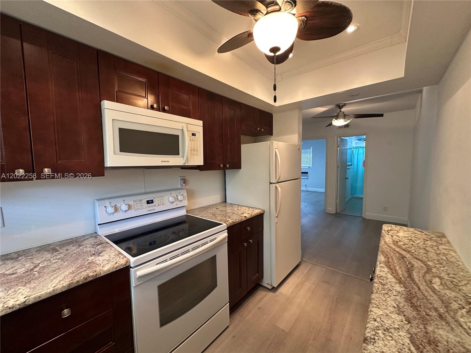 Great opportunity for this this one bedroom one bath updated home in the heart of Hollywood. Own your own home with maintenance fees as low as $229 per month. Awesome location close to Publix, Walgreens, Target, CVS, Banks, TriRail, schools, shopping, hospitals and restaurants. The home interior features a kitchen with newer cherry cabinets with beautiful marble counters, a stainless steel sink and faucet. Enjoy New Waterproof flooring throughout and new window blinds as well as new lighting with 4 ceiling fans. 2 Spacious walk in closets in both living room and bedroom offer ample storage. The Suburbanite complex is very well maintained and is a self managed building. A Heated swimming pool, community recreation room, a barbeque area, laundry room and an extra storage locker complete the package! The Building has a new roof and fresh paint! All ages welcome! Sorry No Leasing. Short drive to the beach, I-95 and the Florida Turnpike. The Police station and Fire department is right across the street! Call listing agent for showings.