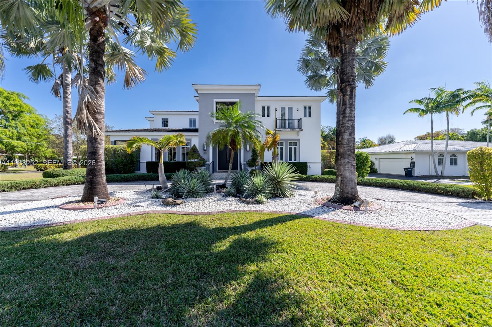 Stunning Corner Home in Gables by the Sea
This exceptional corner residence offers the ultimate in luxury and comfort. Featuring 7 bedrooms and 7.5 beautifully designed bathrooms, this spacious home boasts a large gourmet kitchen with stainless steel appliances and a bright breakfast area. The elegant family/Florida room showcases marble floors throughout, creating a seamless flow of sophistication.
Step outside to your private outdoor oasis, complete with a bar, summer kitchen, living area, lush garden, and sparkling swimming pool — ideal for entertaining or relaxing in style. Professionally decorated with designer finishes, this chic and elegant gated home combines beauty and functionality.
Enjoy peace of mind with the security of a gated community. Every bedroom features its own walk-in closet and private bath, offering comfort and privacy for all.