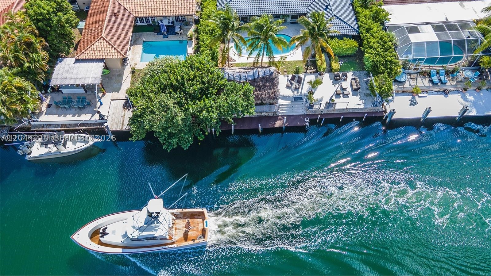 Exceptional waterfront residence in the prestigious Keystone Point community! Situated on a quiet cul-de-sac, this beautiful 3-bedroom, 3-bathroom home plus office offers the perfect blend of comfort, privacy, and the ultimate South Florida lifestyle. Boaters and fishing enthusiasts will appreciate the direct ocean access just minutes from Biscayne Bay. The resort-style outdoor space is designed for entertaining, featuring a sparkling pool, an impressive oversized tiki hut, and waterfront views. Inside, the home offers spacious living areas, abundant natural light, and a versatile office ideal for working from home or accommodating guests. Nestled in one of North Miami's most sought-after waterfront neighborhoods, this property presents a rare opportunity to enjoy boating and fishing!