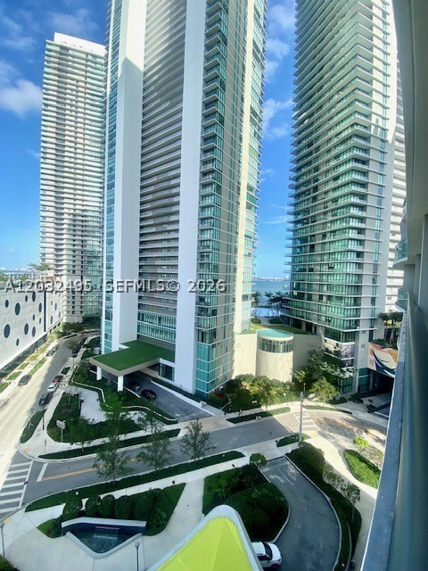Beautiful 1-bedroom, 1.5-bath residence at Paraiso Bayviews featuring floor-to-ceiling impact windows, abundant natural light, and a spacious private balcony with partial water views. Modern open-concept layout and an ideal floor plan for both end users and investors. Assigned parking space conveniently located on the same access level as the residence, providing direct access without ramps.

Enjoy an outstanding collection of resort-style amenities, including two swimming pools, one located on the spectacular 46th-floor rooftop with breathtaking views of Biscayne Bay and the Miami skyline, state-of-the-art fitness center, spa, sauna, tennis courts, children's playroom, business center, social lounges, valet parking, and 24-hour concierge service.

Ideally located in the heart of the Paraiso District, within walking distance to Whole Foods Market, restaurants, cafés, pharmacies, and banks, and just minutes from Midtown, Design District, Wynwood, Downtown Miami, and Miami Beach. Excellent opportunity as a primary residence, second home, or investment property in one of Miami's most desirable neighborhoods.
