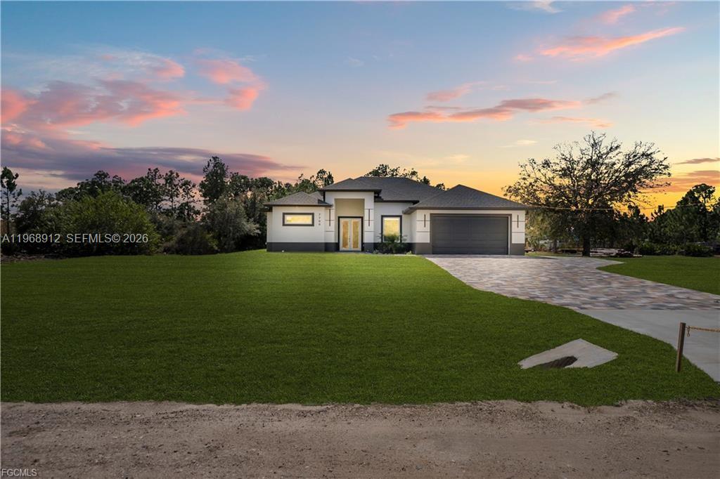 Situated on an expansive 1.25-acre lot, this one-of-a-kind property offers true freedom and space—ideal for parking multiple vehicles, planting trees, creating your own outdoor retreat, or even raising animals. A rare opportunity in the area, this single-family home stands out as one of the few properties of its kind, combining land, privacy, and modern living in a growing location. The residence features 3 spacious bedrooms plus a dedicated office/den, 2 modern bathrooms, and a functional layout designed for comfort and everyday living. The primary suite offers a spa-like bathroom with two showers and a separate bathtub, providing both convenience and luxury. Built with quality and peace of mind, the home includes hurricane-impact windows and doors throughout, premium finishes, and a 2-car garage. This is a turnkey home delivering the perfect blend of acreage, style, and durability—ideal for buyers seeking space, flexibility, and long-term value on Florida’s Gulf Coast. Seller is offering $10,000 toward buyer’s closing costs. Schedule your private showing today and experience the potential of this exceptional property.