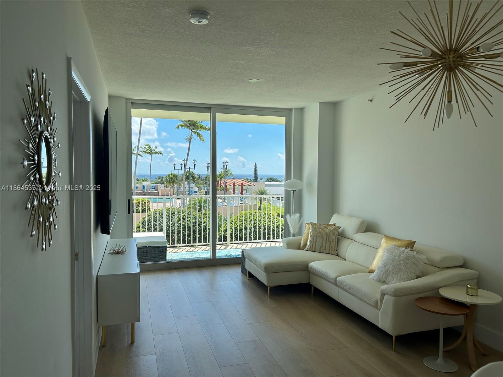 GORGEOUS OCEAN VIEW! Best view in the building! Centered around beautiful pool, landscaping, and a panoramic ocean view. Must see to appreciate! Turn key, ready to move in. This renovated unit has new oak laminate floors, baseboards, paint, custom range hood, chandeliers, nest a/c, smart lights, faucets, hardware and hinges. No assessments. No waiting period required to be used as a rental property. Resort style amenities include pool and jacuzzi, double lounge chairs with intercoastal view, large gym, tennis, pickle ball, pool table, 24 hour security and front desk. Located in the same driveway as Shooters Waterfront and Mastro’s Ocean Club. One block from several restaurants, bars, and shopping. HOA dues include DIRECTV, internet, water, sewer, trash, and gated parking.