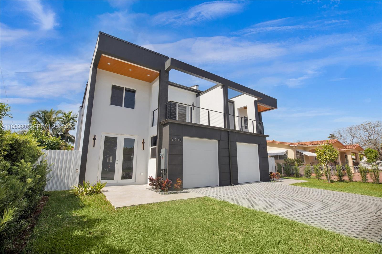 This newly constructed townhome, just minutes from Coral Gables, combines contemporary design with understated elegance. It features 3 spacious bedrooms, 2.5 well-appointed baths, and a flexible garage with a full-size window—purposefully designed for conversion into a fourth bedroom, home office, or fitness space. The chef’s kitchen showcases Samsung appliances, custom European cabinetry, and waterfall quartz countertops. Notable details include 7-ft imported Turkish doors, Italian-designed closets, and a statement wood staircase with a bespoke California-style railing. Impact-rated windows and doors provide security and comfort, while a tranquil covered deck overlooks lush landscaping, offering a private outdoor escape. A rare chance to own brand-new construction in one of Miami’s most sought-after and centrally located neighborhoods.