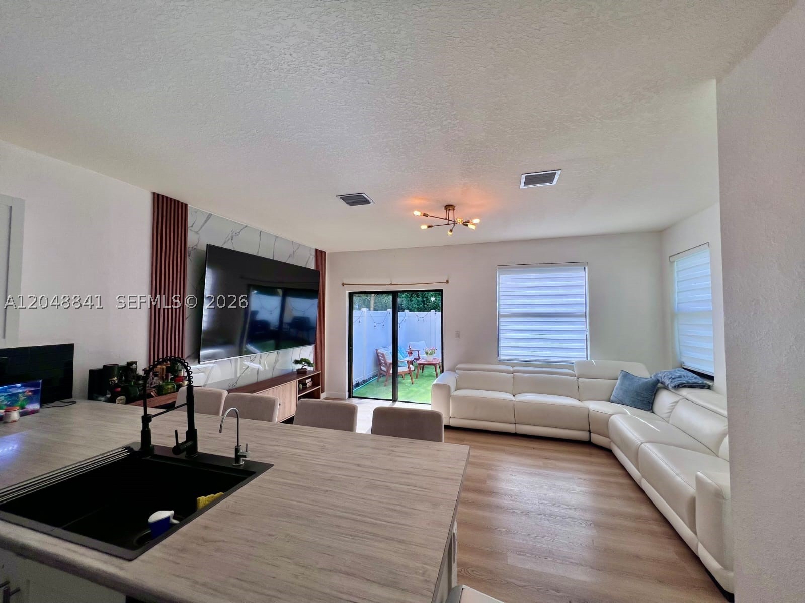 Modern 2021-built townhome in the desirable Aquabella North community of Hialeah! This 3-bedroom, 2.5-bath home offers 1,540 SF of well-designed living space, first-floor entry, and contemporary finishes throughout. Kitchen equipped with electric range, microwave, and refrigerator — move-in ready. Central electric heating and cooling for year-round comfort. Perfect for anyone seeking quality, location, and a nearly-new home. Won't last — schedule your showing today! Association approval required. Submit all offers via MLS Offers.