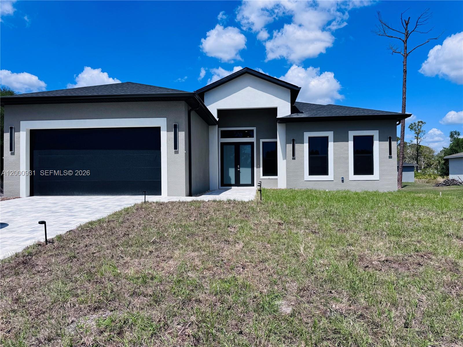 2026 New Construction Masterpiece in Port Charlotte! This architectural gem redefines luxury with 10-ft ceilings and a stunning open design. Features a Private Smart- Income Suite with a separate entrance—perfect for short-term rentals or guests to help offset your mortgage. The chef’s kitchen shines with custom soft-close cabinetry, exotic granite, and premium Samsung appliances. Enjoy high-end finishes like large-format Spanish porcelain tile and spa-like baths. Built for safety with full impact-rated windows and a reinforced 2-car garage. Your oasis awaits with an expansive backyard, BBQ area, and a large lanai with a dedicated pool bath—ready for your future pool. Prime location just 4 mins from Walmart/Home Depot and close to Gulf Coast beaches. High-design homes with income potential sell fast- schedule your private tour today!