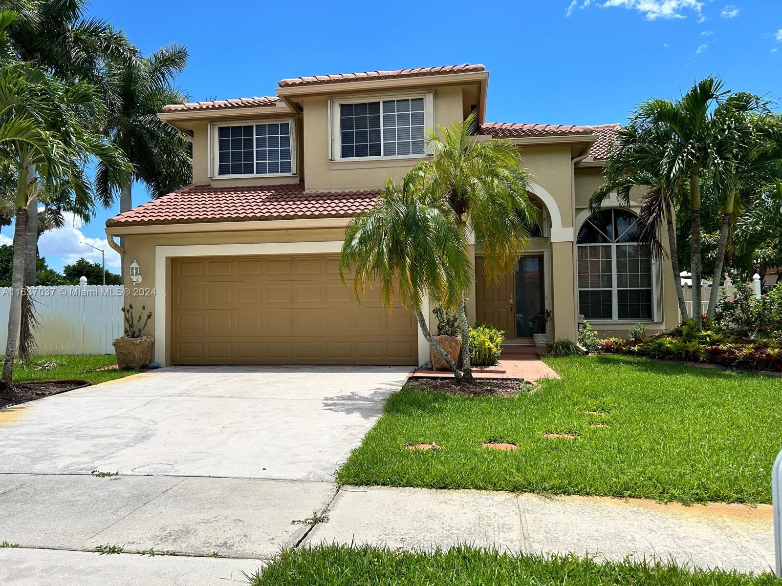 Stunning 4 bedroom, 2 bath home on a spacious corner lot. 4th bedroom features an open concept perfect for a home office. High volume ceilings and a harmonious blend of tile and wood flooring. Its open-concept kitchen is a culinary dream, featuring sleek granite countertops and modern stainless-steel appliances. Outside, the covered patio offers a tranquil retreat, complemented by lush mango and avocado trees. With its generous backyard space, this home is ideal for both relaxation and entertainment. Located conveniently near top-rated schools and a variety of amenities, this property is truly a gem waiting to be discovered. Community amenities include picnic areas, playground, pool, volleyball, and boaters' paradise. This home is a must see!