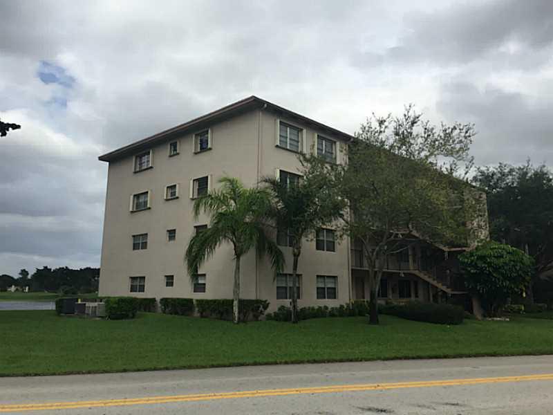 The very amazing Century Village: new floor, new window treatments and new appliances. Ready-to-move in this perfect 2/2 is a MUST. The Golf Course is your back yard!