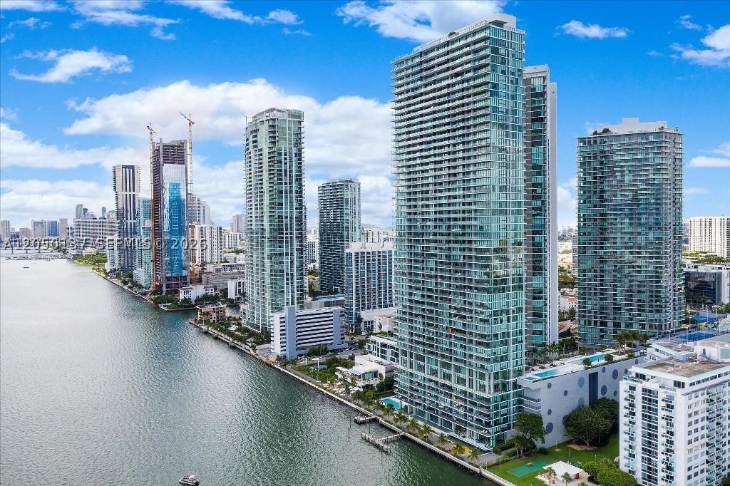 A stunning waterfront condo in picturesque Edgewater, Miami. This 3-bedroom, 3.5-bath residence offers a spacious open floor plan, expansive corner balconies, and panoramic bay views. Ideal for those who prefer low-floor living, the unit is set on a low floor right by the water, creating an exceptional connection to the bay. Features include marble floors, stainless steel and Miele appliances, and semi-private elevators that open to a large private foyer. The assigned parking space is on the 3rd floor with direct access to the unit, a rare and highly convenient feature. Enjoy resort-style amenities including a pool, fitness center, party room, billiards, spa, and more. Conveniently located near shopping, dining, and entertainment.