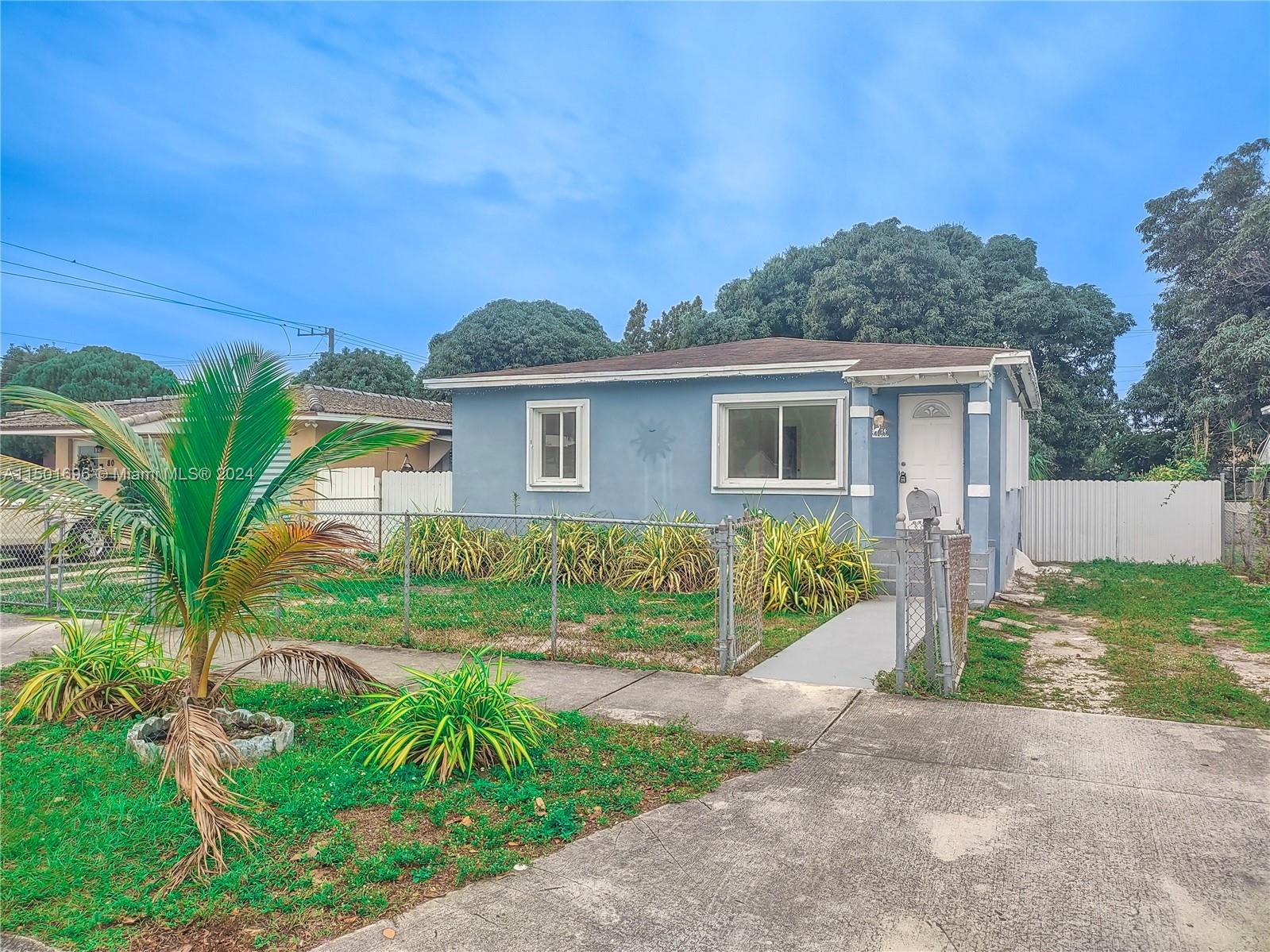 This beautiful 2 bedroom, 1 bathroom single family home is perfect for a growing family. A fresh, modern color scheme with updated lighting and central air conditioning. Enter through the  into a full-size living/dining room connecting to a full-size kitchen with breakfast area. The bedrooms have full size closets. Hurricane shutters available for storms. Located on an oversized lot with a large duel driveways plus a huge patio area. There is no shortage of outdoor space. In addition, the yard is fully fenced for privacy. Washer and dryer hookup available.