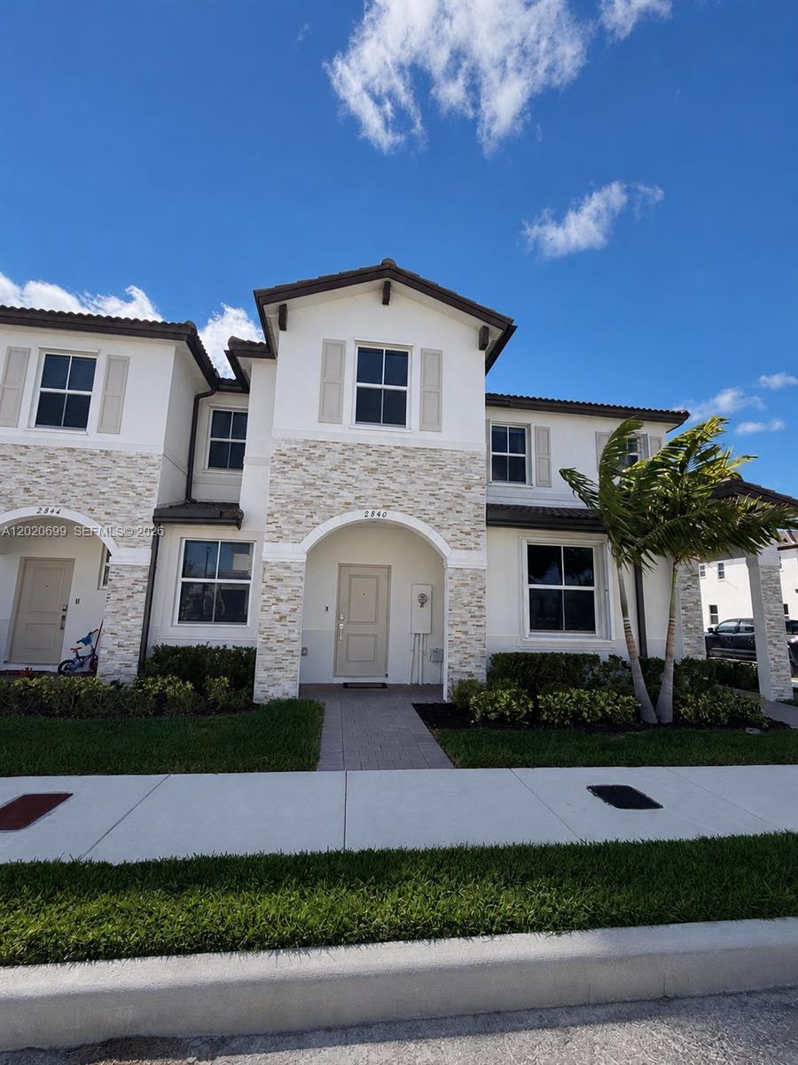 This two-story townhouse features an open-concept layout with the Great Room, kitchen, and dining area seamlessly connected on the first floor. Sliding glass doors provide easy access to the patio and backyard, creating an ideal indoor-outdoor living experience. All three bedrooms are located on the second floor, including a spacious primary suite with a private full bathroom. Community amenities include a clubhouse/clubroom, fitness center, golf course access, and a swimming pool.