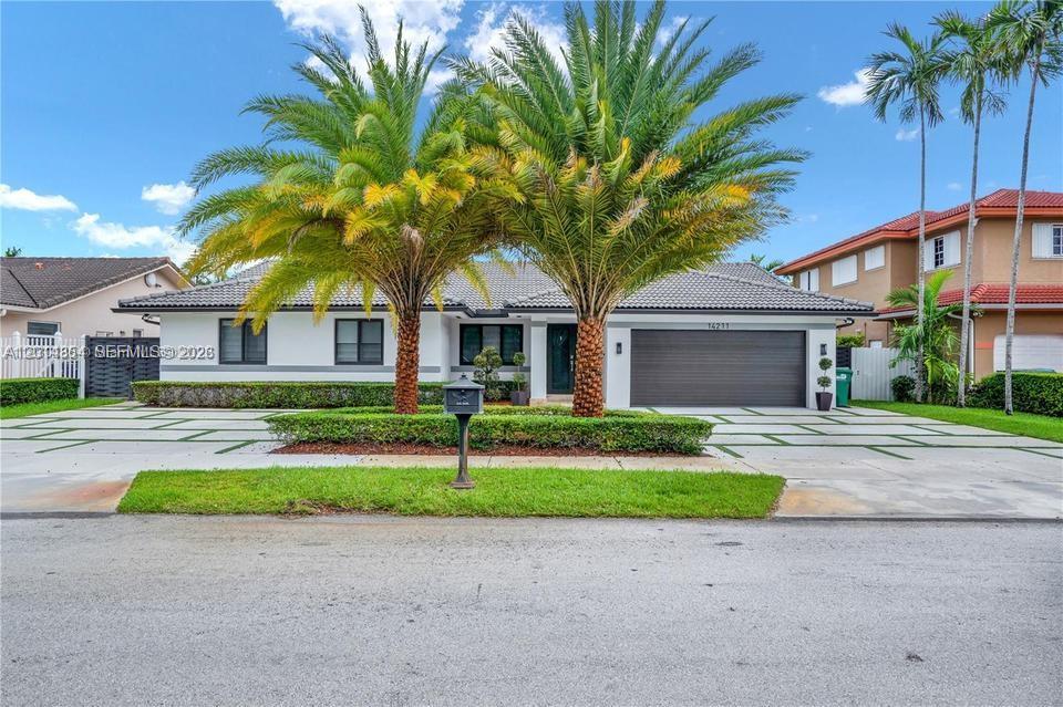 Welcome to your dream home!!! This stunning Miami residence, combines modern elegance with thoughtful design. It features 4 / 2.5.Every bedroom has custom closets .Offers a beautiful kitchen with state-of-the-art appliances, and quartz countertops, including a wall oven and microwave combo, Impact resistance doors and windows. 2 AC Units. The two-car garage has unit AC, custom cabinetry, exit door. Outside enjoy a heated and saltwater pool, expansive patio, outdoor kitchen, built-in grill, and pergola and gas generator Located in a quiet neighborhood with easy access to top schools, shopping, and major roads. Motivated Seller !!!!!! The Dinning room chandelier is not included, as well as the Kids rooms' lamps.