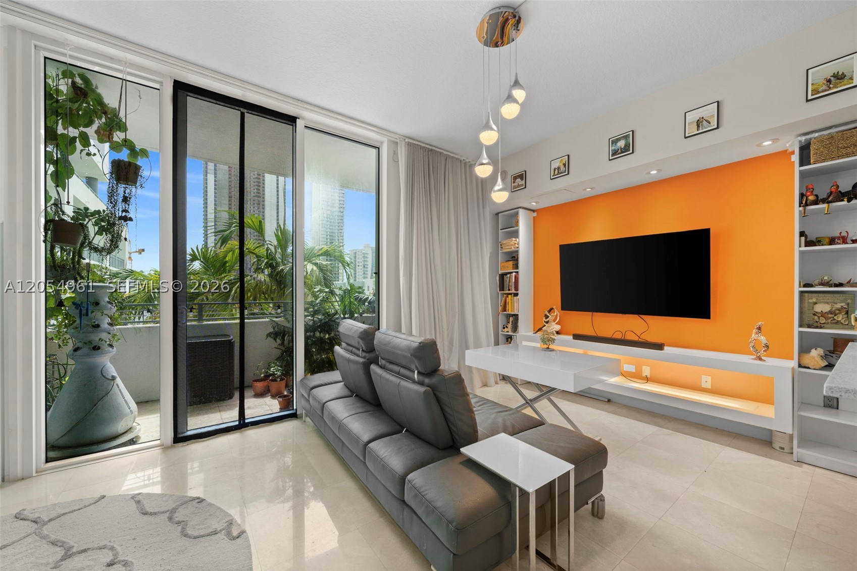 Beautifully updated and move-in ready, this furnished alexa enabled residence offers one of the building's most desirable east-facing exposures with direct pool views and partial Biscayne Bay views from an oversized private balcony. The thoughtfully designed open-concept one-bedroom layout creates a bright, spacious feel and features a custom floor-to-ceiling blackout, sound-reducing room divider, providing privacy while maintaining the airy loft-style design. Interior upgrades include elegant marble flooring throughout, a beautifully renovated bathroom, and a modern kitchen with stainless steel appliances. Offered fully furnished, this home is ideal as a primary residence, second home, or investment property. City 24 offers resort-style amenities including a pool, fitness center, club room, business center, 24-hour front desk/security, and covered garage parking. Ideally located in the heart of Edgewater, just minutes from Wynwood, Midtown, the Design District, Brickell, Downtown Miami, the beaches, and Miami International Airport. Enjoy the perfect combination of style, location, and convenience in one of Miami's most vibrant neighborhoods. Tenant occupied through September 30, 2026; unit available beginning October 1, 2026. Please allow advance notice for showings.