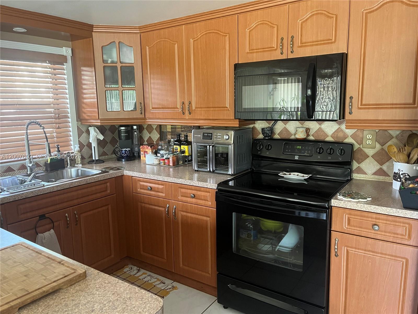 Beautiful 2/2 spacious corner unit at first floor in town of Davie. The condominium association has sufficient reserves and All Ages, No restrictions; therefore, only a 5% down payment is required for financing. Gorgeous unit with an open, bright layout and fully renovated kitchen. Both bedrooms are master suites with walk-in closets. Includes two assigned parking spaces. Washer/dryer inside the unit. Nearby Nova university and Broward community college. Access to community pool with gym, tennis, and basketball courts. Conveniently located near 595,Turnpike, University Drive and State Road-7. Newly painted and ready to move in condition.