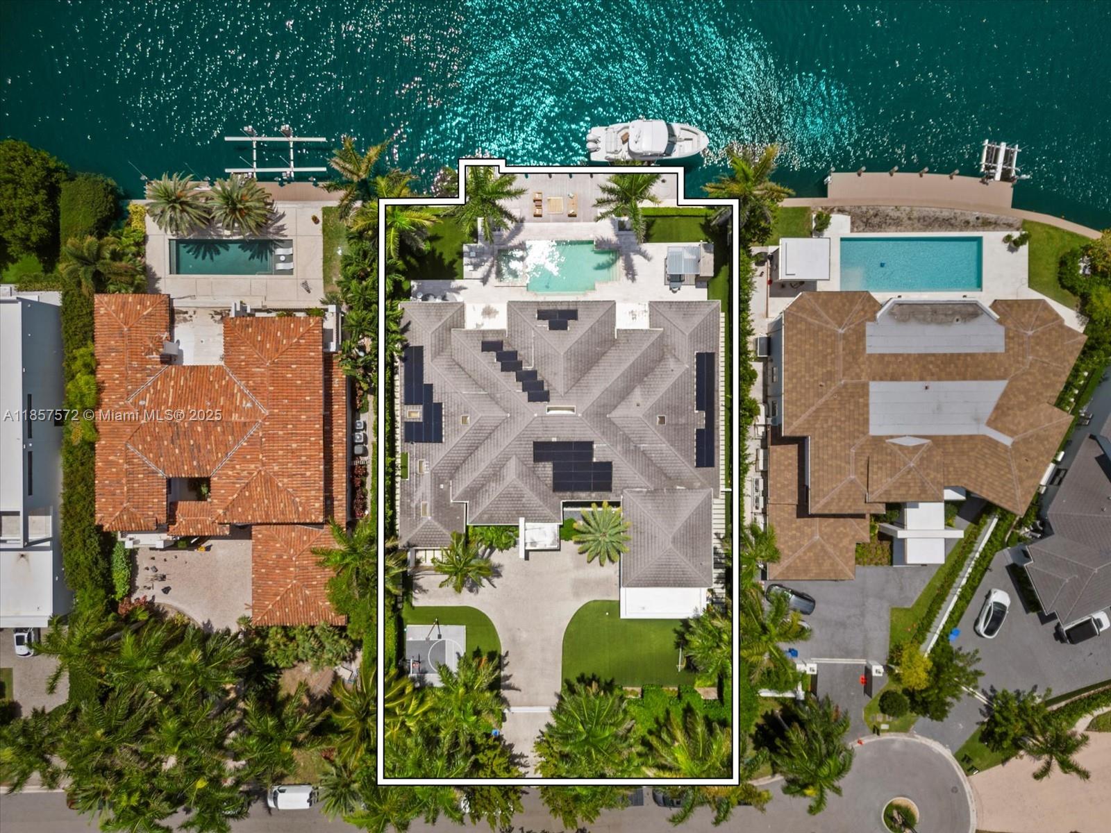 Welcome to your dream home in Golden Beach's exclusive South Island! This unique turnkey one-story residence, set on an oversized 18,975 sqft lot, features a spacious open floor plan with soaring 16 ft ceilings. Revel in stunning waterfront living with 115 ft on the water, complete with a newly built boat lift and a yacht and jet ski-equipped dock. The home boasts 6 luxurious suite bedrooms, including an oversized master suite with an outside Bali-style bathroom, a gym, and a second-floor in-law's or a teenager's dream unit . The manicured resort-like outdoor space is perfect for entertaining. Decorated to perfection and designed for the ultimate entertainer, this custom masterpiece offers unmatched amenities and is one of the most unique and desirable  properties in the neighborhood.