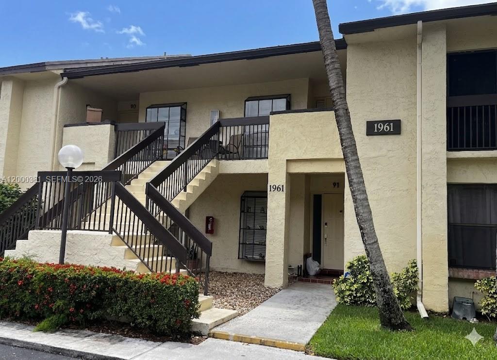 Welcome to your versatile oasis in Meadowridge East! This beautifully maintained condo offers a rare feature: a fully enclosed lanai/porch with impact windows and a dedicated closet, creating the perfect sun-drenched home office, guest room, or den. Enjoy a bright floor plan that flows effortlessly, providing the ideal backdrop for both relaxation and entertaining.  Located in a vibrant, all-ages community in Deerfield Beach, you are steps away from a refreshing pool, clubhouse, and lush park views. Enjoy the peace of mind that comes with a serene environment. This is an incredible place to call home. Close to I-95, pristine beaches, and premier shopping—this is Florida living at its finest. Come see the possibilities for yourself!