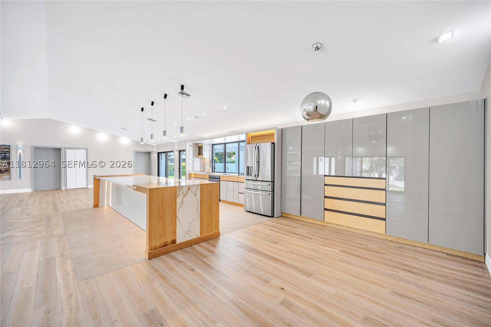 Refreshed, Renewed, and Better Than Ever! This masterfully reimagined 4-bedroom plus den, 3-bath residence showcases the latest in modern design with newly completed custom cabinetry, designer closets, and premium finishes throughout. The open-concept floor plan is filled with natural light and enhanced by elegant ceramic flooring. The chef's kitchen features custom cabinetry, ambient lighting, and exceptional craftsmanship. The spacious primary suite offers a true retreat, while major upgrades—including a new metal roof, electrical, plumbing, A/C, and septic system—provide complete peace of mind. Situated on an oversized lot with a resort-style pool, this turnkey home delivers luxury, quality, and effortless living.