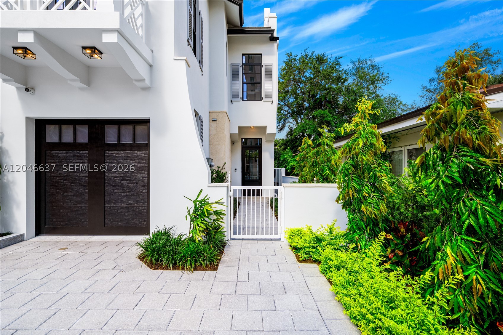 NEW CONSTRUCTION WALKING DISTANCE FROM CORAL GABLES FINANCIAL DISTRICT HAS JUST BEEN COMPLETED! Luxurious 3 bdrm / 2.5 baths, 1 car garage and private yard with plunge pool & BBQ. Kitchens feature Namibia White Calacatta marble countertops, & top-of-the-line Thermador appliances. Eurodesign Italian cabinetry with German Blum self-closing hardware. Spanish porcelain 32” x 64” floors in living areas. 11’ ceilings on the 1st floor & soaring 13-16’ ceilings on the 2nd floor. Bathrooms feature oversized 48” x 110” porcelain, Venatino Fantastic Quartz countertops & Grohe fixtures. Steel columns with reinforced concrete construction with ES impact resistant windows, solid 8’ concrete dividing wall between units and double-insulation roofs. Fully built out closets + tankless water heaters. Wired for Sonos with installed speakers throughout, Ring entry cameras + 4 additional perimeter cameras. Each yard features a tri-level mosaic tiled plunge pool with heater & 5 jets + Dominican Keystone lined walls. Automated irrigation sub-meter system sub-meter, exterior lighting controllable by app & concrete perimeter fence. Walking distance to Coral Gables Financial District with dozens of restaurants, shops & cafes providing the ultimate in urban living.