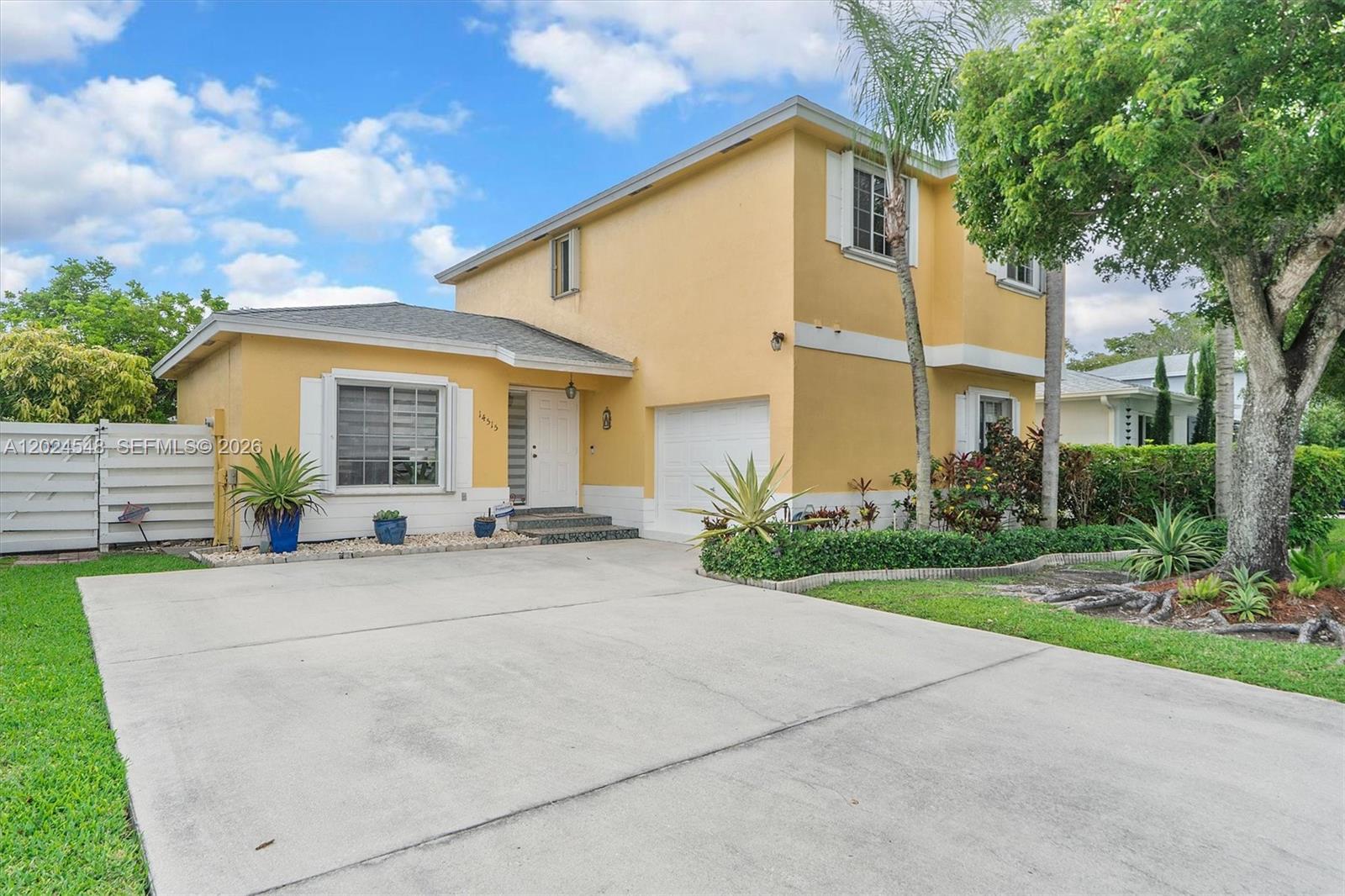 Charming 2-story, 3-bedroom, 2.5-bath single-family home with a garage, nestled on a quiet circular street in the highly desirable West Kendall area. This bright and sun-filled home features elegant wood and tile flooring, crown molding, a cozy family den, and a formal dining room with direct access to the outdoor living space.

The beautifully maintained kitchen offers stainless steel appliances, white cabinetry, a tiled mosaic backsplash, and a convenient breakfast bar, perfect for both everyday living and entertaining. Upstairs, you’ll find a spacious primary suite along with versatile secondary bedrooms that can easily serve as guest rooms, a home office, or flex space.

Enjoy peace of mind with a brand-new roof and accordion shutters throughout, providing complete hurricane protection for all windows.

Step outside to your own private tropical retreat featuring a fully fenced backyard, paved patio, lush green lawn, and beautifully landscaped surroundings — ideal for relaxing or hosting gatherings. Conveniently located just minutes from top-rated schools, parks, dining, and London Square shopping.