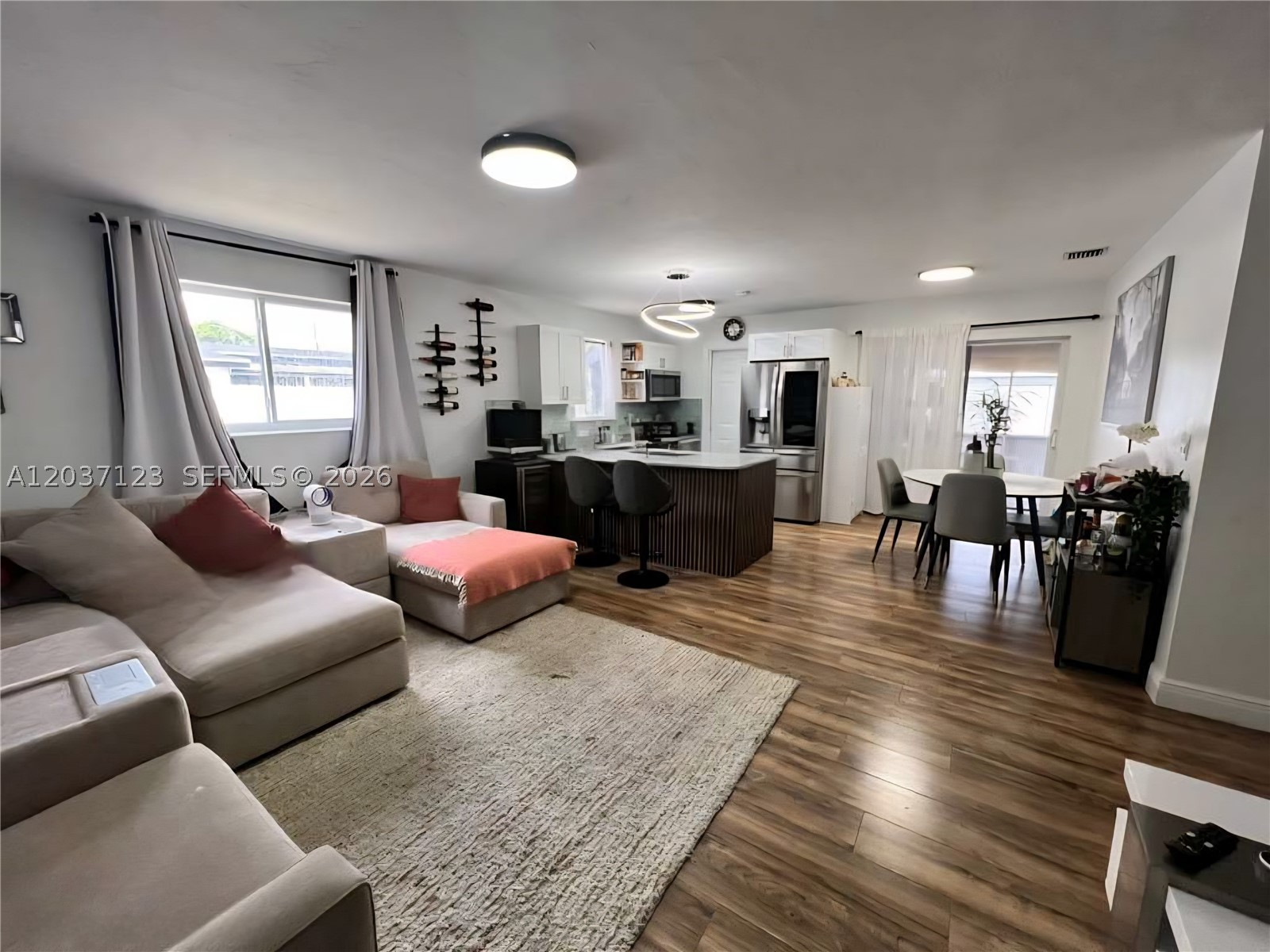 Beautifully updated 4-bedroom, 2-bath home offering modern comfort, style, and functionality in one of the area’s fastest-growing neighborhoods! This move-in-ready property features a stunning contemporary kitchen with top-of-the-line appliances, elegant quartz countertops, and a spacious walk-in pantry. A dedicated laundry room adds everyday convenience, while all impact windows provide peace of mind and energy efficiency throughout the home. Enjoy a large backyard , entertaining, or creating your dream outdoor oasis. The property is fully fenced with durable aluminum fencing and includes a modern front gate that enhances both privacy and curb appeal. Need space for your toys? The oversized side yard offers plenty of room for a boat, RV, or additional parking. Conveniently located just 2 miles from Hard Rock Stadium, this home is positioned in a highly desirable and rapidly evolving area surrounded by new developments, shopping centers, dining, and future growth opportunities. A perfect blend of location, lifestyle, and value!