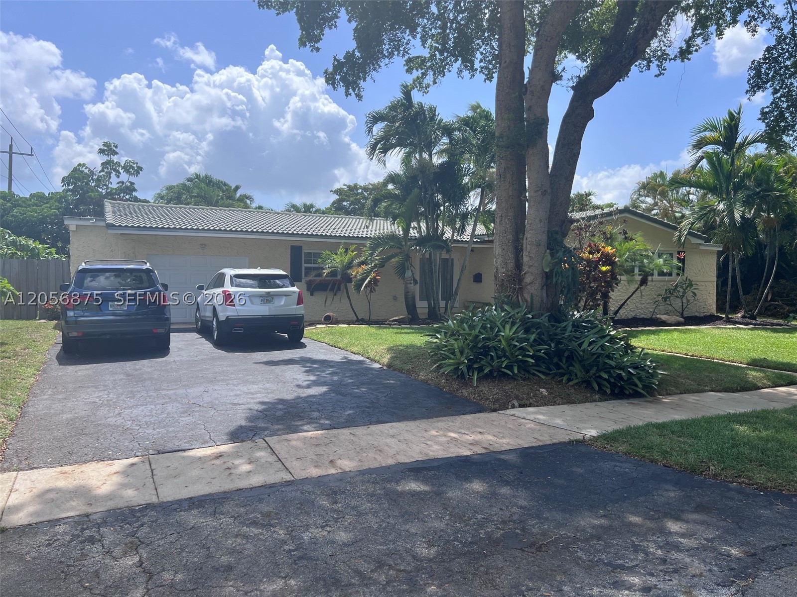 Spacious Oasis in Plantation! This home features 2,866 sq. ft. of living area under A/C on an oversized 13,500 sq. ft. lot with a sparkling pool, mature fruit trees, and South Florida outdoor living at its finest—complete with a BBQ area perfect for entertaining friends and family! Located in one of Plantation's most desirable neighborhoods with NO HOA, this property offers formal living and dining rooms, plus two Florida rooms filled with natural light. The floor plan includes 3 comfortable bedrooms, featuring a primary suite with a walk-in closet, 2 bathrooms with showers, a dedicated laundry room, and an attached garage. Ideally situated between Fort Lauderdale and Miami, close to top-rated schools, Fort Lauderdale Airport, major hospitals, and sunny beaches.