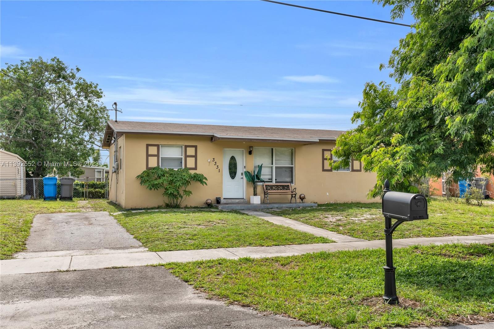Welcome to this charming, single-family home located in the tranquil neighborhood of West Park, Florida. This delightful property offers a cozy main residence with three bedrooms, one full bath, and one half bath, along with an additional live-in trailer that can serve as a potential rental income opportunity or extra storage space. Upon entering the kitchen, you will be greeted by tasteful granite countertops, SS Samsung appliances, and an accommodating, stackable Samsung washer/dryer combo. Conveniently located, this property presents an excellent opportunity for those seeking comfort and versatility. With a lot size of 7,505 square feet, there is ample room to expand and add on to the existing home, allowing you to customize the property to your preferences and maximize its potential.